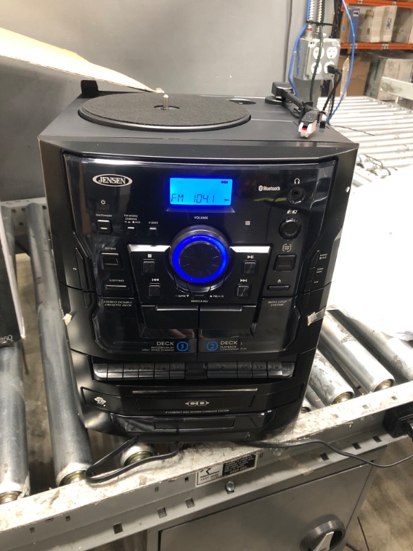 Photo 1 of MINOR DAMAGE SEE PICTURE Jensen® Bluetooth® 3 Speed Stereo Turntable 3 CD Changer Music System with Dual Cassette Deck, Pitch Control and Remote Control