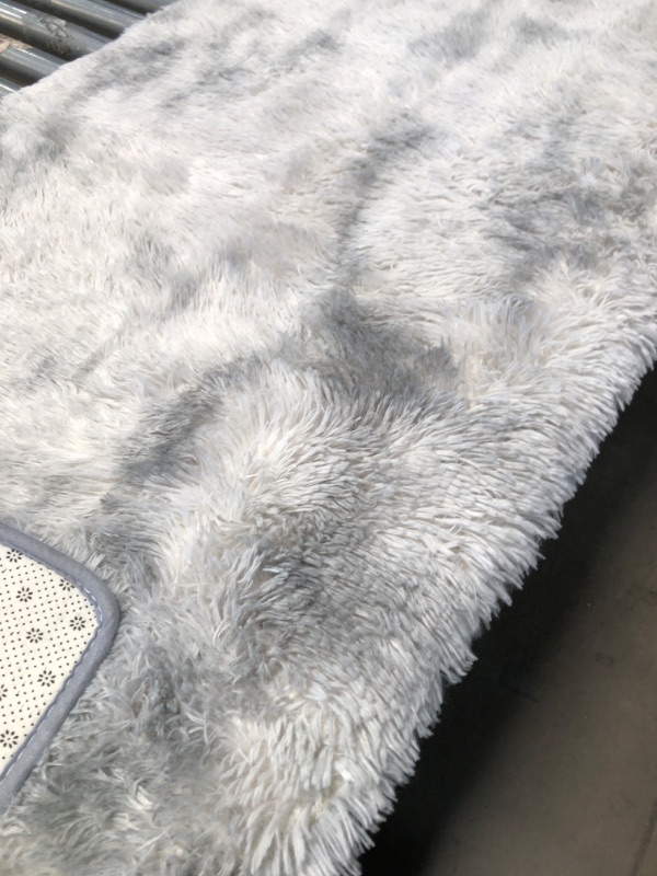 Photo 4 of (LIKE NEW)  84x60" Plush Light Grey/White Gradient Faux Fur Area Rug with Beige/Black Floral Non-Slip Pattern Backing 