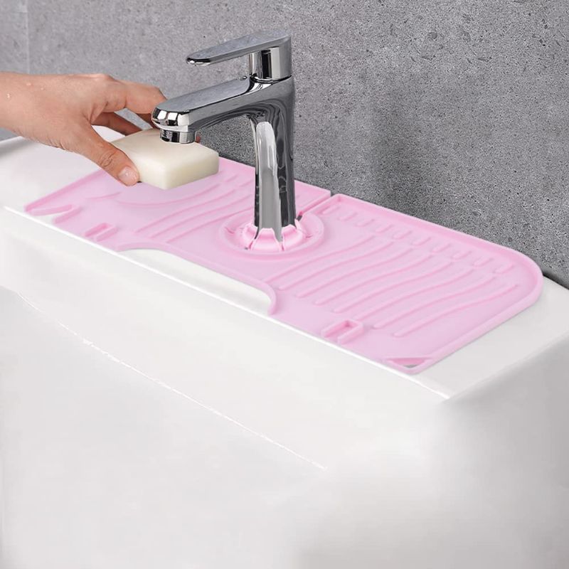 Photo 1 of Adjustable Silicone Faucet Sink Splash Guard Faucet Splash Catcher Mat Sink Faucet Water Catcher Faucet Drip Catcher Tray for Kitchen and Bathroom Decoration Pink