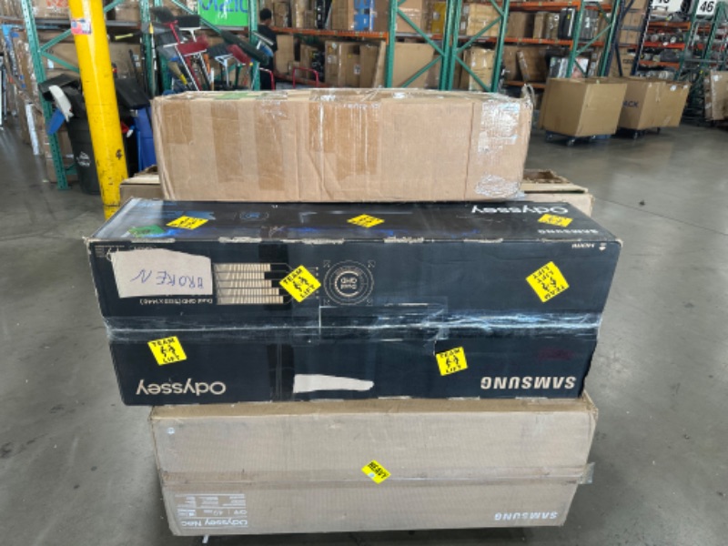 Photo 1 of **PALLET OF 7 BROKEN TVS AND MONITORS** MISSING ACCESSOREIS**DAMAGED 