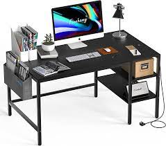 Photo 1 of DAMAGED TABLE CORNERS**Finnhomy 47" Computer Desk with Power Outlets & Storage Shelves, Reversible Corner Desk for Writing, Gaming in Home Office or Bedrooms, Modern Small Home Office Desk with Storage Bag, Black
