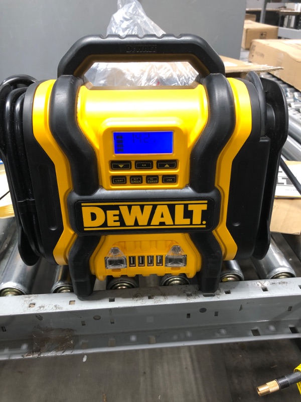 Photo 2 of DEWALT DXAEPS14 1600 Peak Battery Amp 12V Automotive Jump Starter/Power Station with 500 Watt AC Power Inverter, 120 PSI Digital Compressor, and USB Power , Yellow