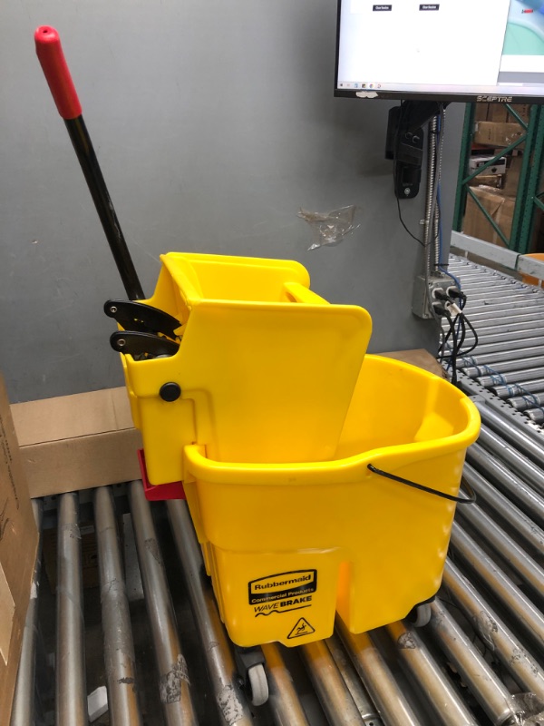 Photo 2 of **MINOR TEAR & WEAR**Rubbermaid Commercial Products, WaveBrake - Commercial Industrial Mop Bucket with Side-Press Wringer Combo on Wheels, 35 Quart, Yellow Yellow Bucket and Wringer