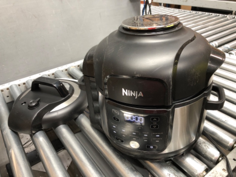 Photo 4 of **MINOR DAMAGE** Ninja FD302 Foodi 11-in-1 Pro 6.5 qt. Pressure Cooker & Air Fryer that Steams, Slow Cooks, Sears, Sautés, Dehydrates & More, with 4.6 qt. Crisper Plate, Nesting Broil Rack & Recipe Book, Silver/Black
