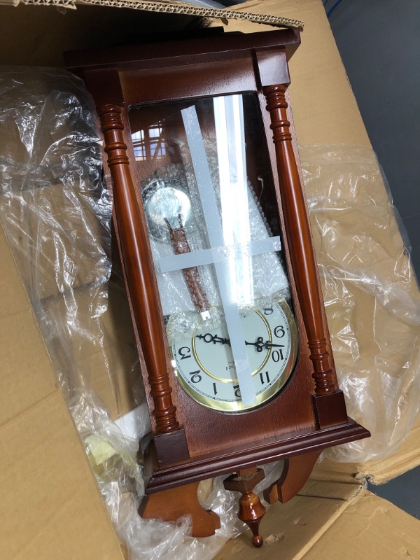 Photo 2 of **Minor damage** Bedford Clock Collection Pendulum and Chime Wall Clock, 25 Inch, Redwood Finish
