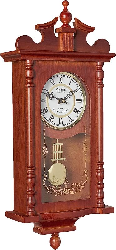 Photo 1 of **Minor damage** Bedford Clock Collection Pendulum and Chime Wall Clock, 25 Inch, Redwood Finish
