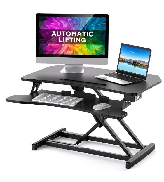 Photo 1 of ABOX Electric Powered Lifting Standing Desk Converter| 34" Height Adjustable Sit Stand Desk Riser| Dual Monitors Removable Keyboard Tray| Black
