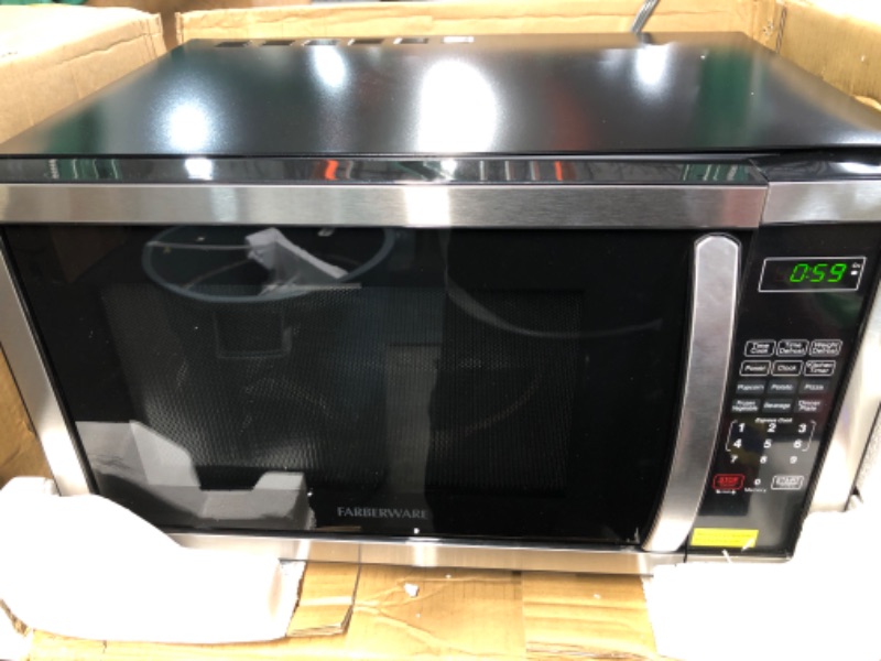 Photo 3 of **DAMAGED**Farberware Countertop Microwave 1.1 Cu. Ft. 1000-Watt Compact Microwave Oven with LED lighting, Child lock, and Easy Clean Interior, Stainless Steel Interior & Exterior