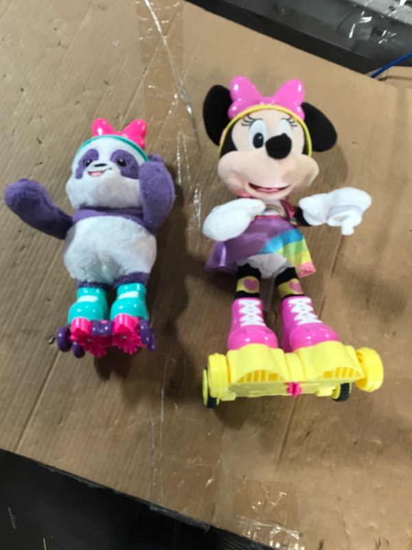 Photo 1 of Disney Junior Minnie Mouse Roller-Skating Party Minnie Mouse, Interactive Light Up Feature Plush with Talking, Singing, and Moving, Includes a Roller-Skating Panda, by Just Play