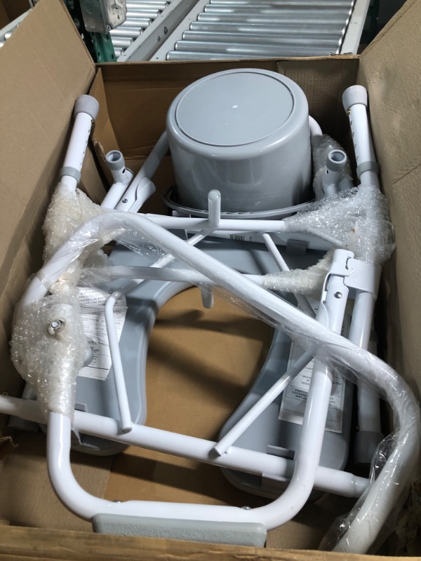 Photo 1 of Medline Drop Arm Commode, Swing Arm Rest for Easy Transfer, Padded Seat, Contains Chair, Pail, Lid, and Splash Guard, 350lb. Weight Capacity