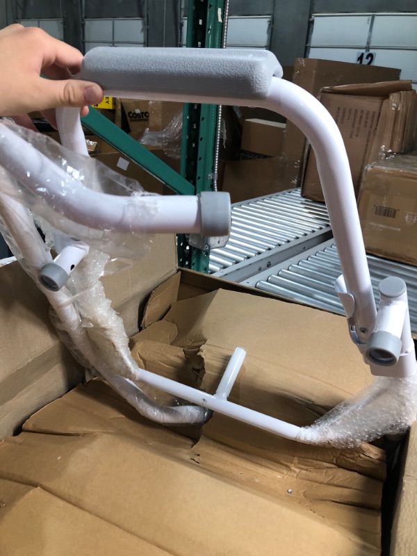 Photo 1 of Medline Drop Arm Commode, Swing Arm Rest for Easy Transfer, Padded Seat, Contains Chair, Pail, Lid, and Splash Guard, 350lb. Weight Capacity