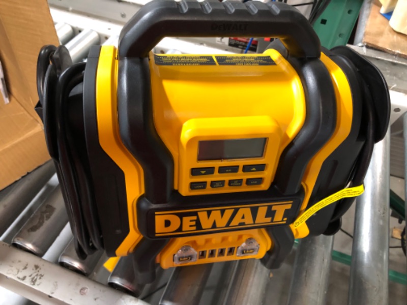 Photo 2 of DEWALT DXAEPS14 1600 Peak Battery Amp 12V Automotive Jump Starter/Power Station with 500 Watt AC Power Inverter, 120 PSI Digital Compressor, and USB Power , Yellow