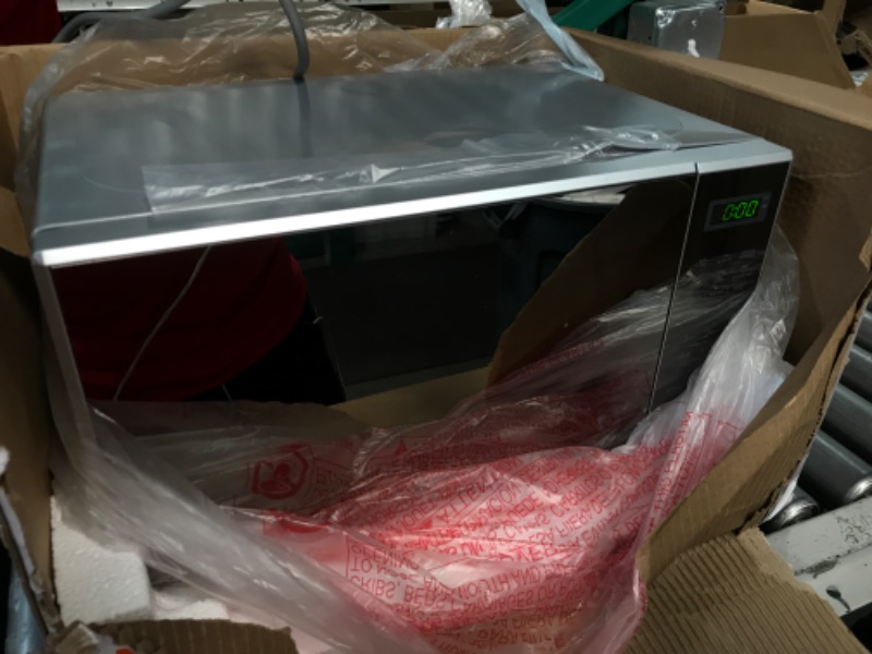 Photo 1 of ***LARGE DENT - SEE NOTES***
COMMERCIAL CHEF Small Microwave 0.7 Cu. Ft. Countertop Microwave with Digital Display