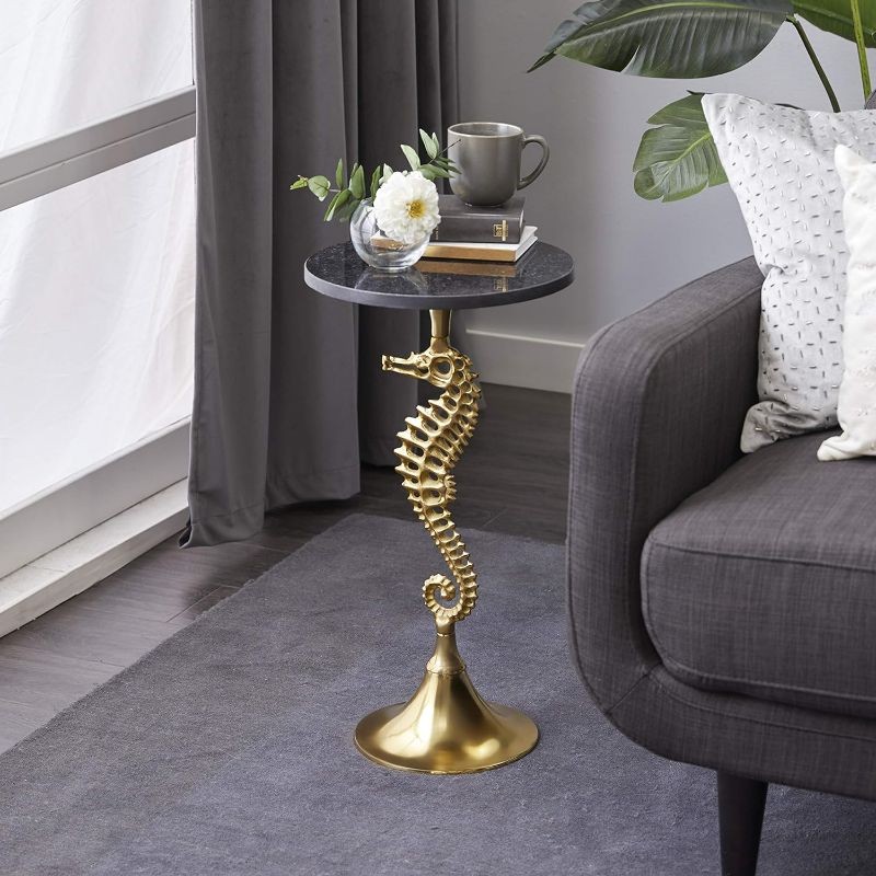 Photo 1 of ***BROKEN END, PARTS ONLY** Deco 79 Aluminum Sea Horse Accent Table with Black Marble Table Top, 13" x 13" x 25", Gold