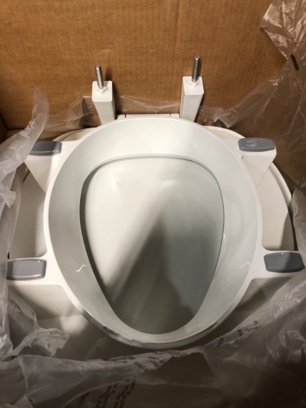 Photo 2 of Bemis 7YR85320H20 Assurance with Clean Shield Support Arms and Bidet Attachment, Round 3" Raised Toilet Seat