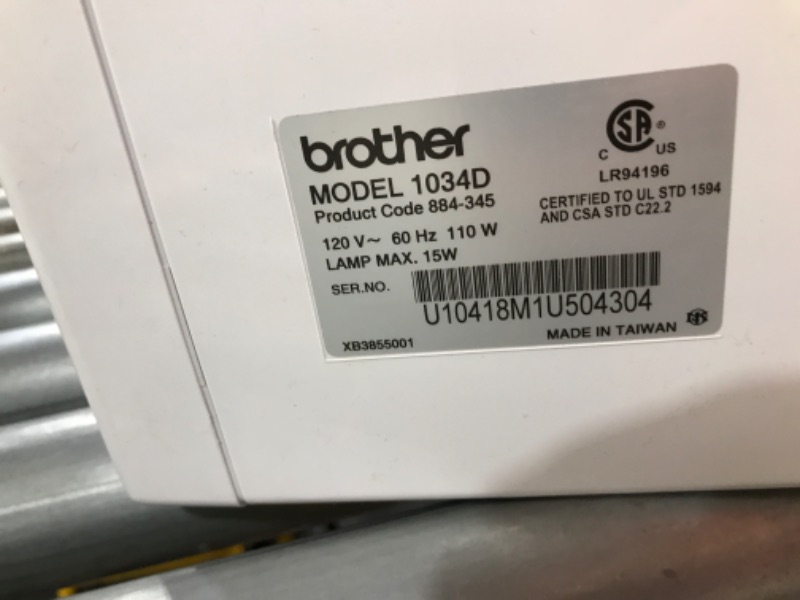 Photo 6 of **USED**Brother Serger, 1034DX, Durable Metal frame Overlock Machine 1,300 Stitches Per Minute, Trim Trap, 3 Accessory Feet and Protective Cover Included