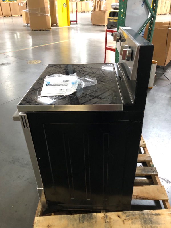 Photo 3 of **POWER LINES ARE CUT SAYS NON FUNCTIONAL**Whirlpool 30-in Smooth Surface 4 Elements 5.3-cu ft Freestanding Electric Range (Stainless Steel)
Item #1678247

Model #WFE320M0JS