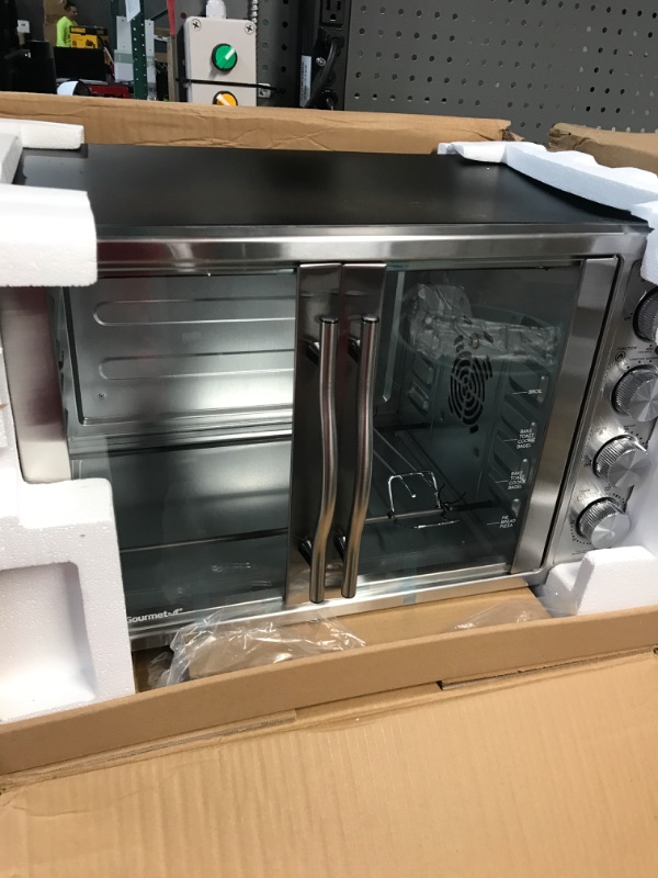 Photo 2 of * DAMAGED * 
Elite Gourmet ETO4510B# French Door 47.5Qt, 18-Slice Convection Oven 4-Control Knobs, Bake Broil Toast Rotisserie Keep Warm, Includes 2 x 14" Pizza Racks, Stainless Steel 18-Slice, 45L With Rotisserie and Convection