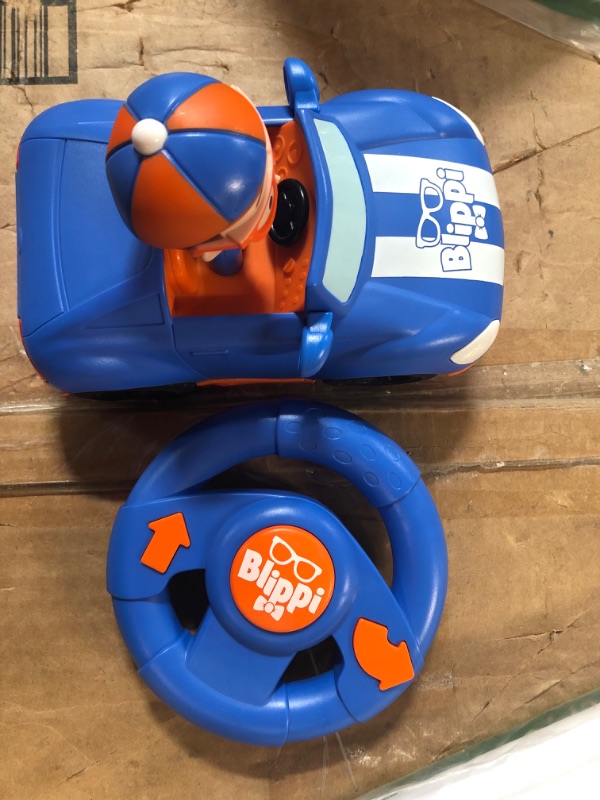 Photo 2 of Blippi Racecar - Fun Remote-Controlled Vehicle Seated Inside, Sounds - Educational Vehicles & Costume Roleplay Accessories, Perfect for Dress Up and Play Time, unisex Blippi Racecar + Roleplay Accessories