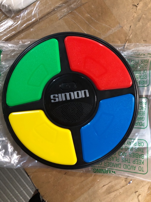 Photo 1 of Hasbro Gaming Simon Handheld Electronic Memory Game With Lights and Sounds for Kids Ages 8 and Up