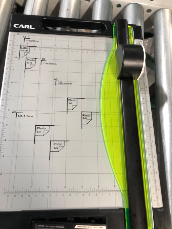 Photo 2 of SEE NOTES 
CARL 12 inch-Green Friendly, Professional Rotary Paper Trimmer, 12-inch, 15 Sheet Cutting Capacity, Black and Silver