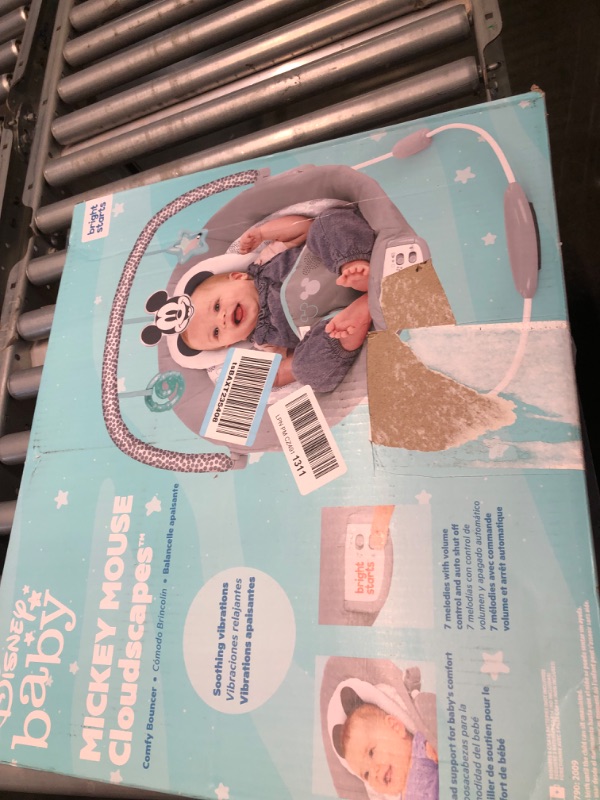 Photo 1 of MICKEY MOUSE Comfy Disney Baby Bouncer in Cloudscapes Includes Bar with 3 Cute, Plays 7 Soothing Melodies w/Auto Shut-Off, Age 0-6 Months