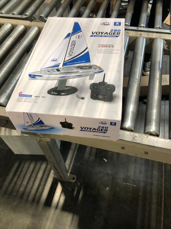 Photo 1 of PLAYSTEAM Voyager 280 RC Controlled Wind Powered Sailboat in Blue - 17.5" Tall