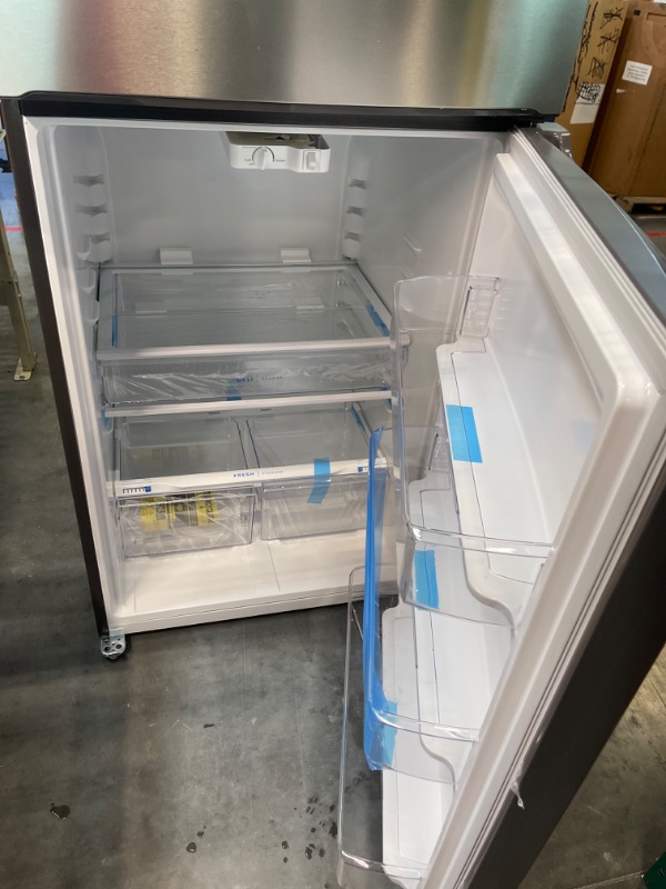 Photo 8 of ***INTERIOR TOP LIGHT ISNT SECURELY ATTACHED - SEE PICTURE*** Frigidaire 20 Cu. Ft. Top-Freezer Refrigerator - Stainless Steel