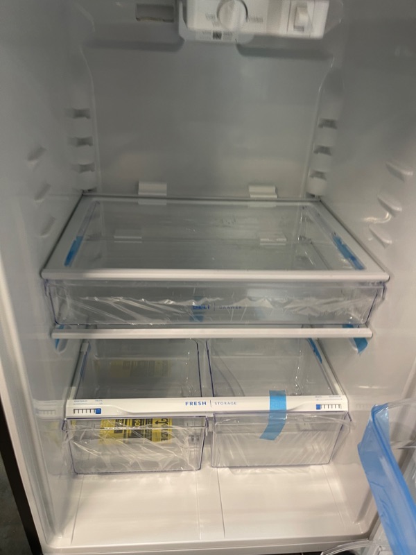 Photo 11 of ***INTERIOR TOP LIGHT ISNT SECURELY ATTACHED - SEE PICTURE*** Frigidaire 20 Cu. Ft. Top-Freezer Refrigerator - Stainless Steel