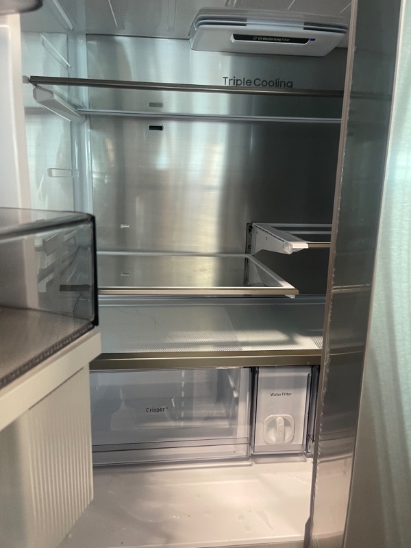 Photo 3 of Samsung 36 Inch Wide 22.8 Cu. Ft. Energy Star Rated Full Size 4-Door Flex Refrigerator
** ORDOR COMING FROM FRIDGE **