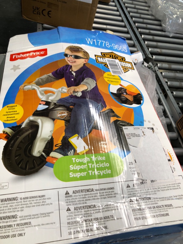 Photo 3 of Fisher-Price Harley-Davidson Tricycle with Handlebar Grips and Storage Area, Multi-Terrain Tires, Tough Trike [Amazon Exclusive]