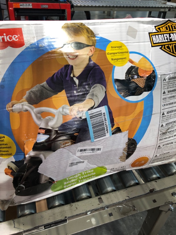 Photo 2 of Fisher-Price Harley-Davidson Tricycle with Handlebar Grips and Storage Area, Multi-Terrain Tires, Tough Trike [Amazon Exclusive]