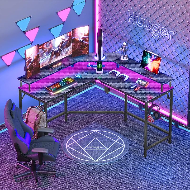 Photo 1 of Huuger L Shaped Gaming Desk with Power Outlets & LED Lights, Computer Desk with Monitor Shelves, Carbon Fiber Surface, Home Office Desk, Corner Gaming Desk with Hooks, Black