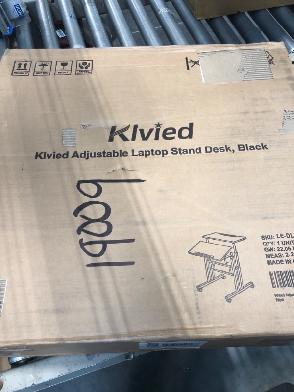 Photo 1 of Klvied Mobile Standing Desk with Cup Holder, Portable Stand Up Desk, Adjustable Height Small Standing Desk, Rolling Desk with Wheels, Home Office Laptop Cart, Computer Desk for Standing or Sitting Black