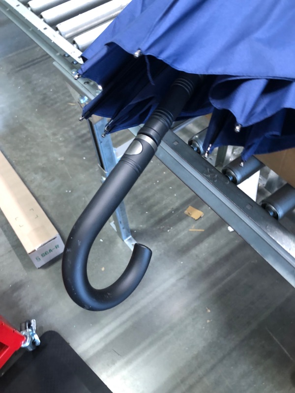 Photo 1 of Blue umbrella with curved handle