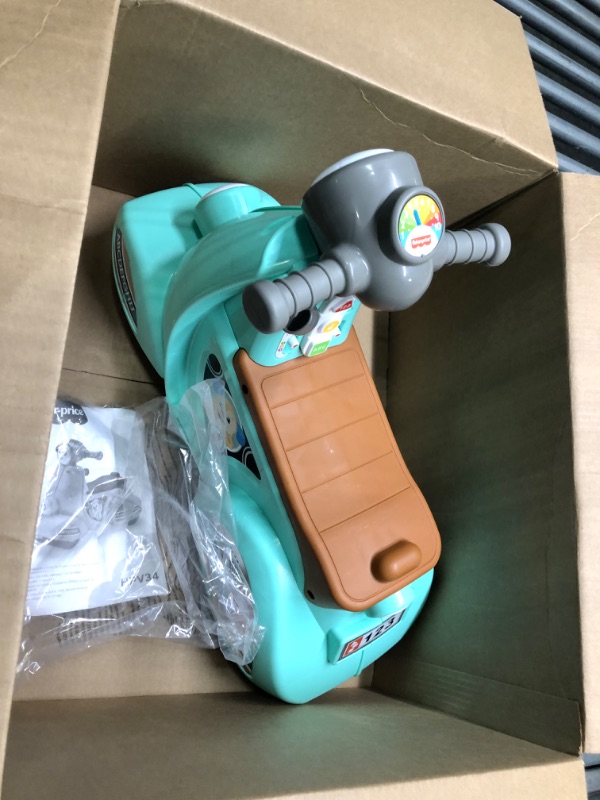 Photo 1 of Fisher-Price Laugh & Learn Toddler Ride-On Toy, Smart Stages Cruise Along Scooter with Lights Music and Learning for Ages 1 Year and Up (Amazon Exclusive), Large, Green