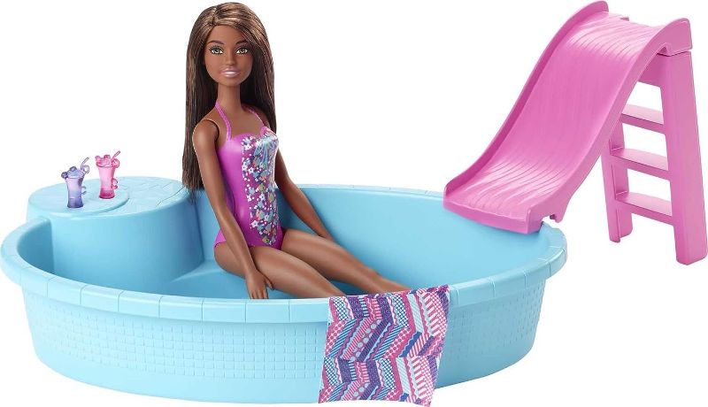 Photo 1 of Barbie Doll and Pool Playset with Pink Slide, Beverage Accessories and Towel, Brunette Doll in Floral Swimsuit
