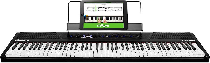 Photo 1 of Alesis Recital – 88 Key Digital Piano Keyboard with Semi Weighted Keys, 2x20W Speakers, 5 Voices, Split, Layer and Lesson Mode, FX and Piano Lessons
