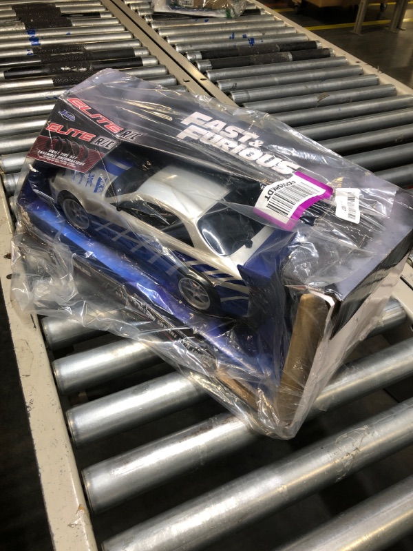 Photo 1 of Jada Toys Fast & Furious Brian's Nissan Skyline GT-R (BN34) Drift Power Slide RC Radio Remote Control Toy Race Car with Extra Tires, 1:10 Scale, Silver/Blue (99701)
