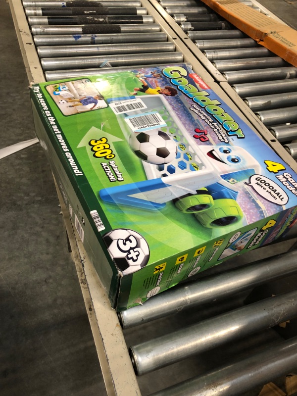 Photo 2 of Fisher-Price Goaldozer Electronic Soccer Game with Net Lights Sounds and Motorized Motion for Preschool Sports Play Standard Packaging