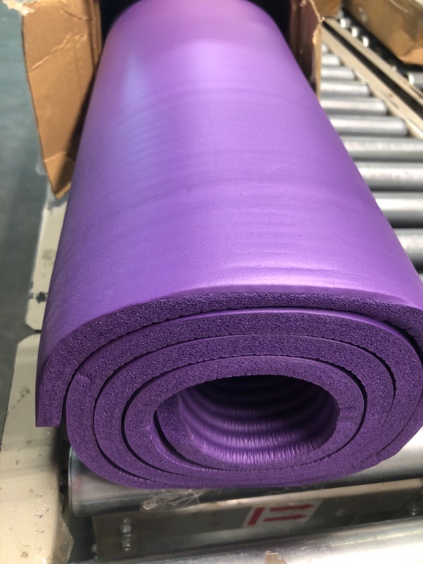 Photo 3 of Amazon Basics Extra Thick Exercise Yoga Gym Floor Mat with Carrying Strap - 74 x 24 x .5 Inches, Purple & High-Density Round Foam Roller for Exercise and Recovery - 36 Inch, Black