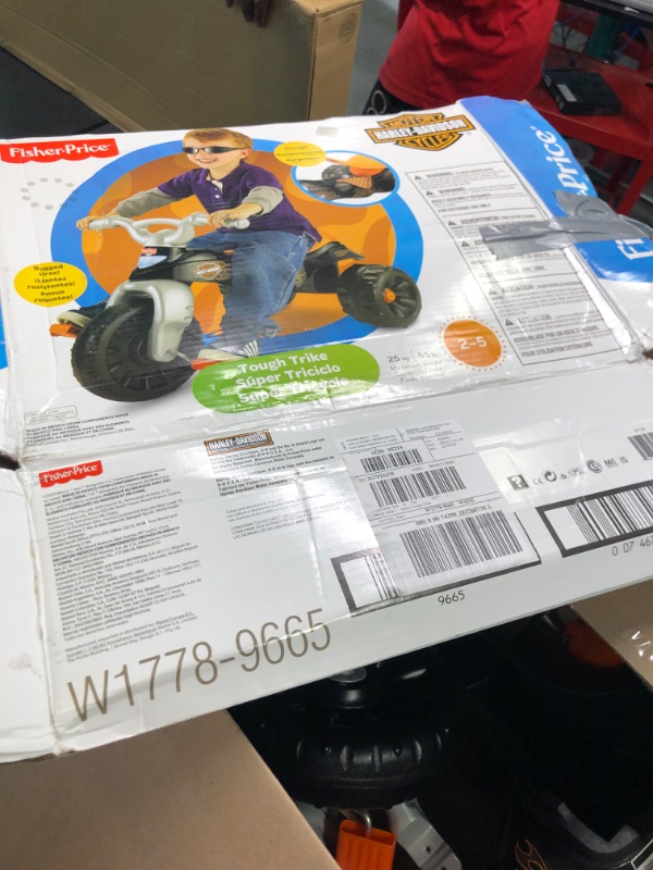 Photo 6 of Fisher-Price Harley-Davidson Tricycle with Handlebar Grips and Storage Area, Multi-Terrain Tires, Tough Trike [Amazon Exclusive]