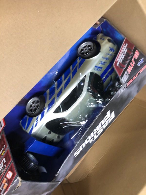 Photo 1 of Jada Toys Fast & Furious Brian's Nissan Skyline GT-R (BN34) Drift Power Slide RC Radio Remote Control Toy Race Car with Extra Tires, 1:10 Scale, Silver/Blue (99701)