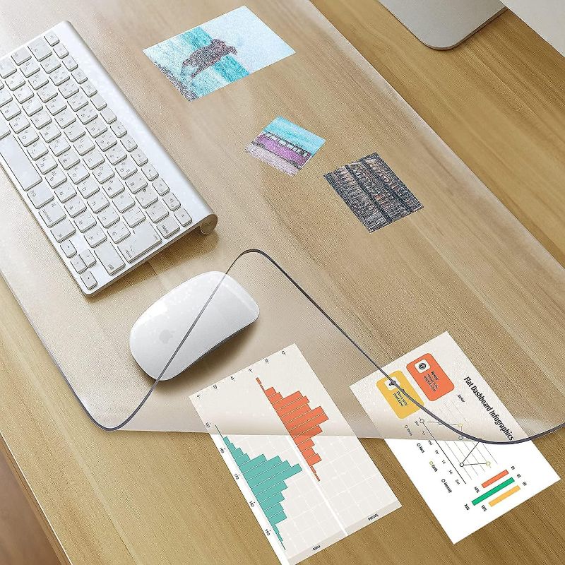 Photo 2 of Clear Desk Mat on top of desks - 24 x 14 inches - Clear Transparent Plastic Desk Protector - Desk Writing Mat for Office and Home