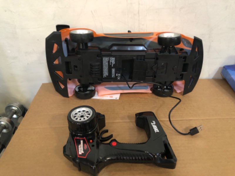 Photo 3 of Jada Toys Fast & Furious Han’s Mazda RX-7 Drift RC Car, 1: 10 Scale 2.4Ghz Remote Control Orange & Black, Ready to Run, USB Charging (Standard) (99700)