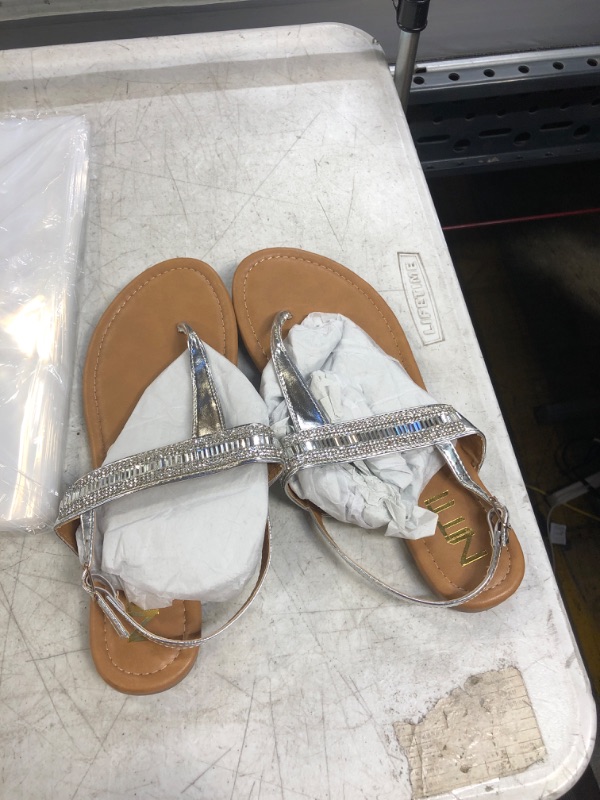 Photo 1 of  WOMEN SIZE 9 SILVER STRAPS SANDALS 