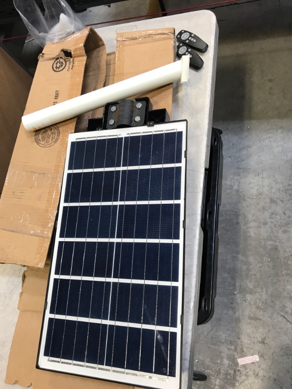 Photo 1 of 2ftx14" solar powered outdoors light with 2 remotes