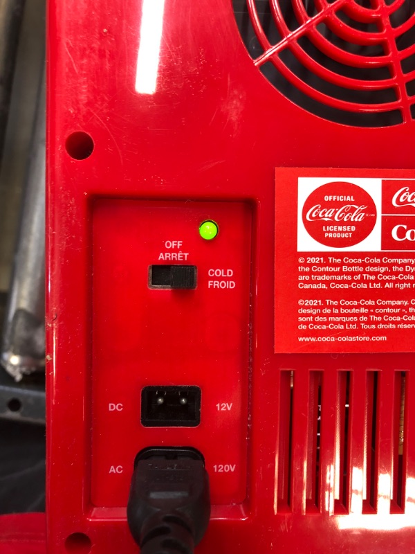 Photo 1 of Coca-Cola 6 Can Mini Fridge 4L Mini Electric Cooler 12V Car Cooler
