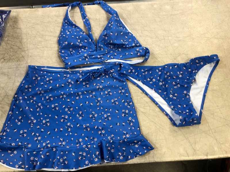 Photo 1 of 3 PIECE -BIKINI SET -TOP BOOTOM AND SKITRT
COLOR-BLUE W/ FLOWERS 
SIZE-SMALL