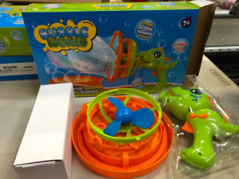 Photo 1 of Dinosaur Bubble Gun Machine for Kids Bubble Blower Toy for Toddles Party Favors with 8 Floz Bubble Solution - Birthday Gift for 3 4 5 Year Old Boys Girls Outdoor Toys Summer Water Toys Outside Toys
